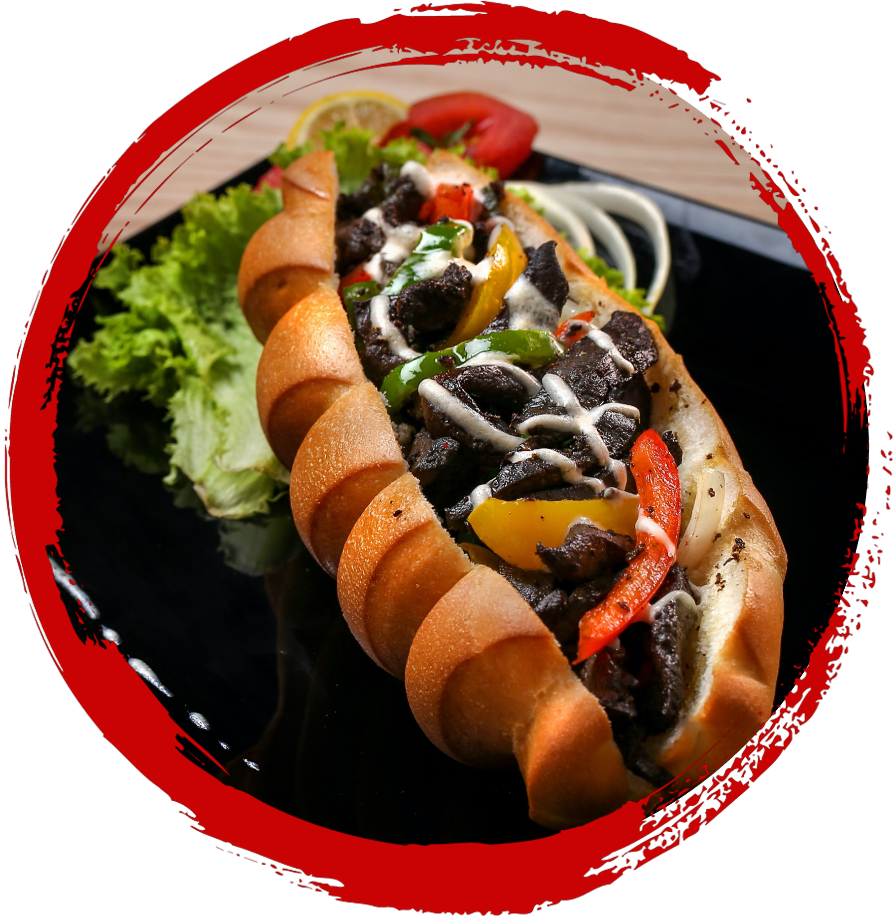 A sandwich on a black plate with condiments